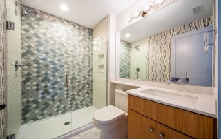 Creative bathroom tile design for your coastal cottage or beach house or vacation rental on the Outer Banks by SAGA Realty and Construction