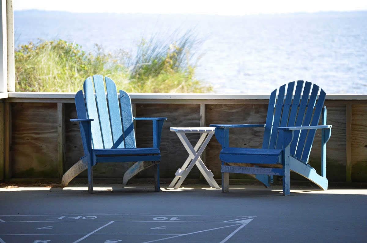 Waterside villages shuffle board in pavilion chairs currituck sound new homes SAGA