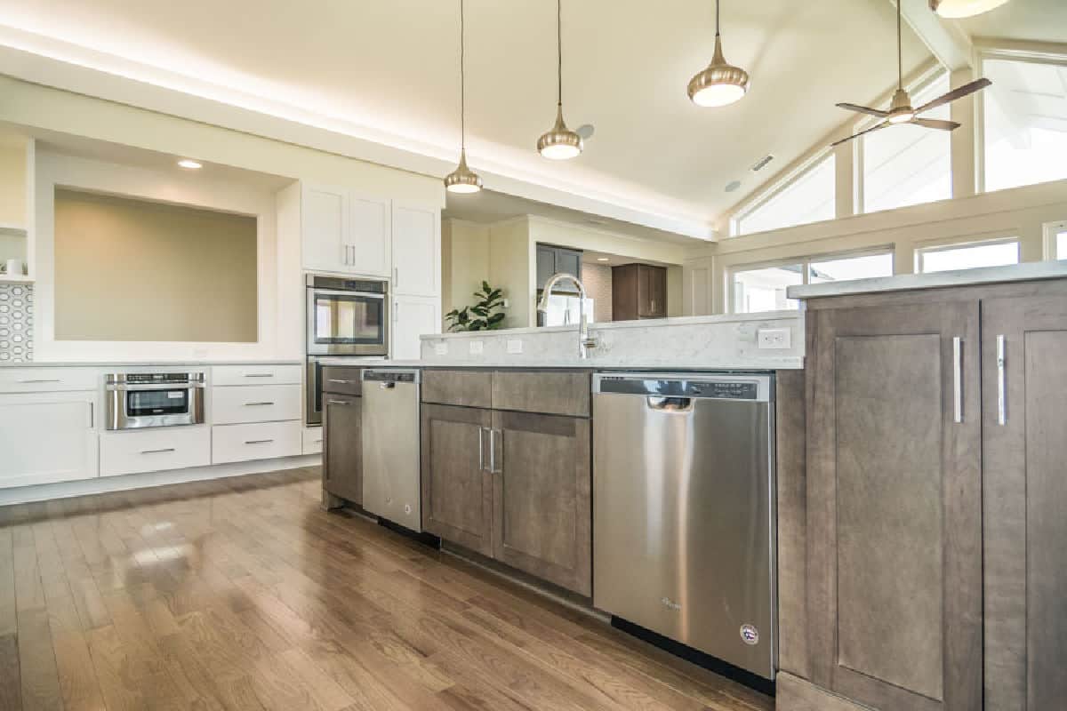 Island and dishwashers open floor plan kitchen design on the Outer Banks built by SAGA Realty and Construction