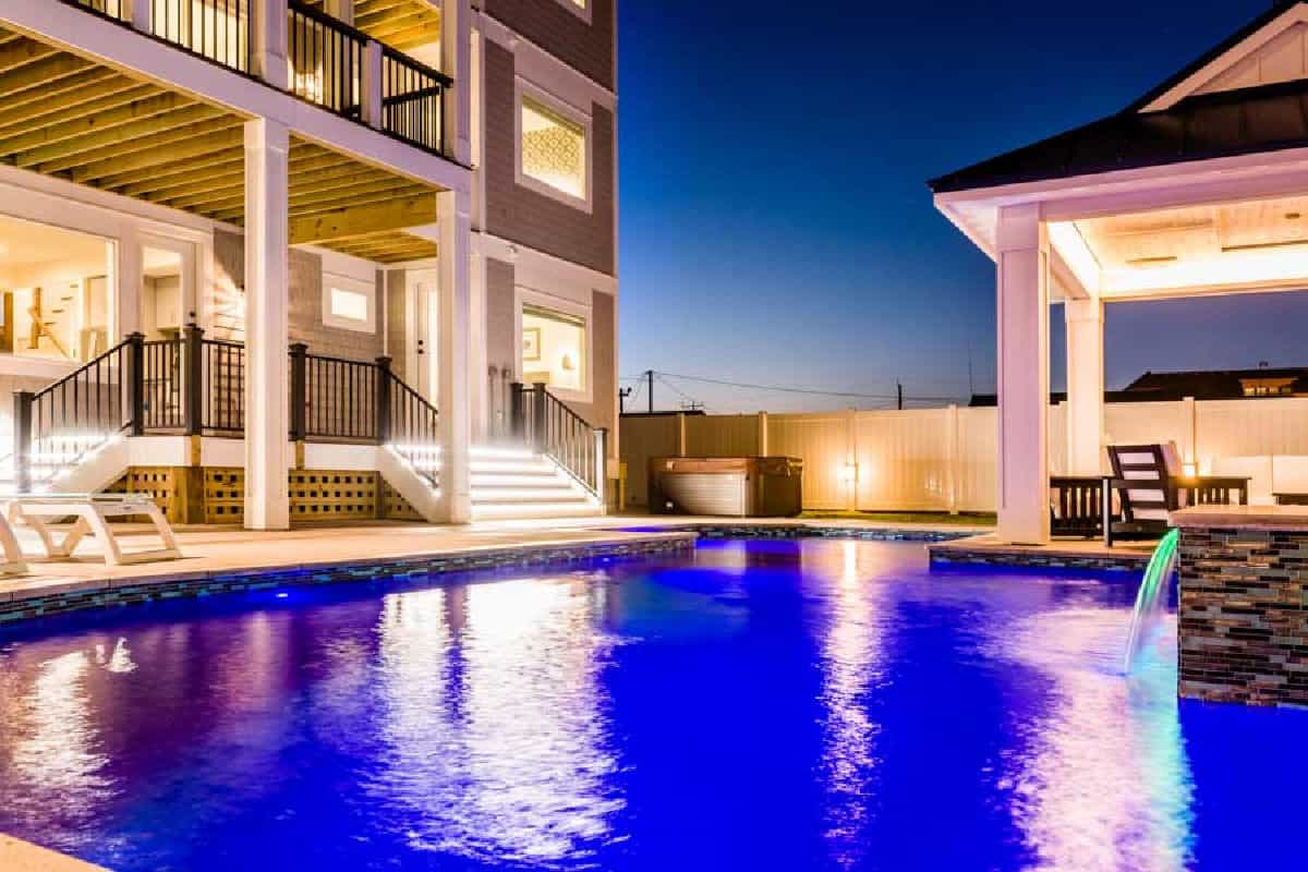 Pool at night - Sweet Carolina is a beautiful vacation home in Nags Head North Carolina on the Outer Banks built by SAGA Realty and Construction